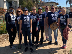 group image of eight people 7 are wearing Long beach community foundation tshirts